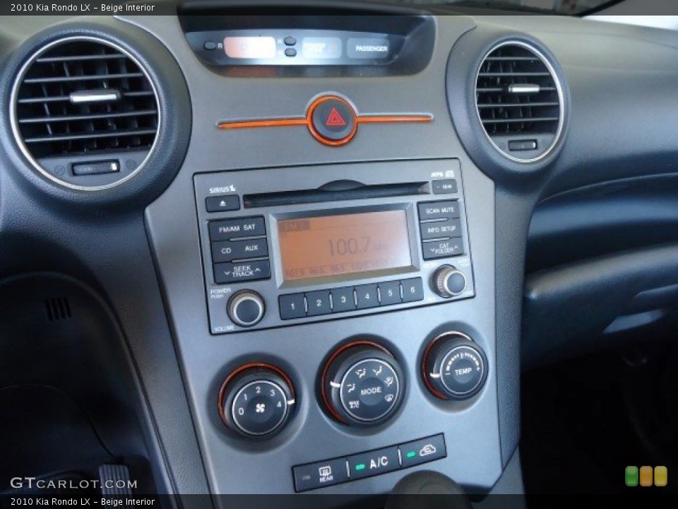 Beige Interior Controls for the 2010 Kia Rondo LX #82605065