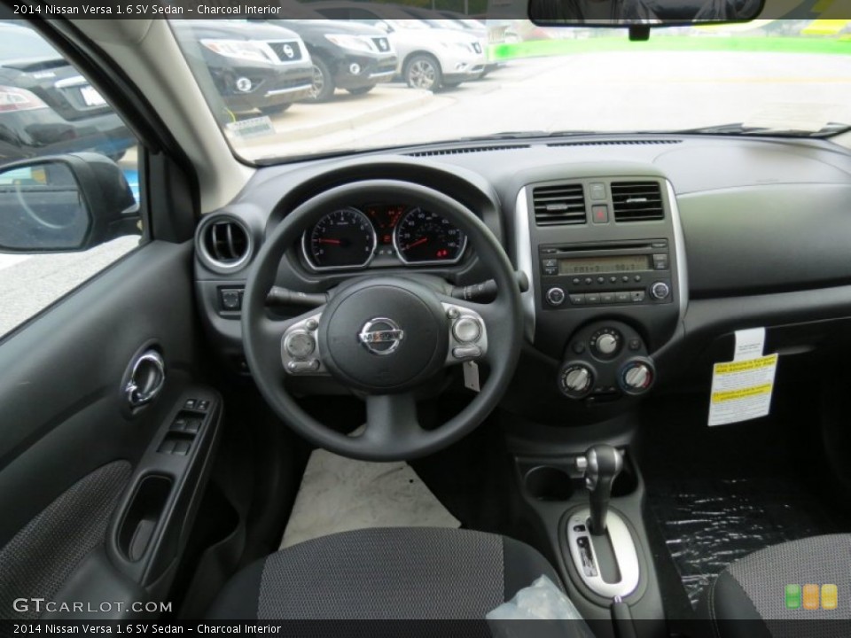 Charcoal Interior Dashboard for the 2014 Nissan Versa 1.6 SV Sedan #82622060
