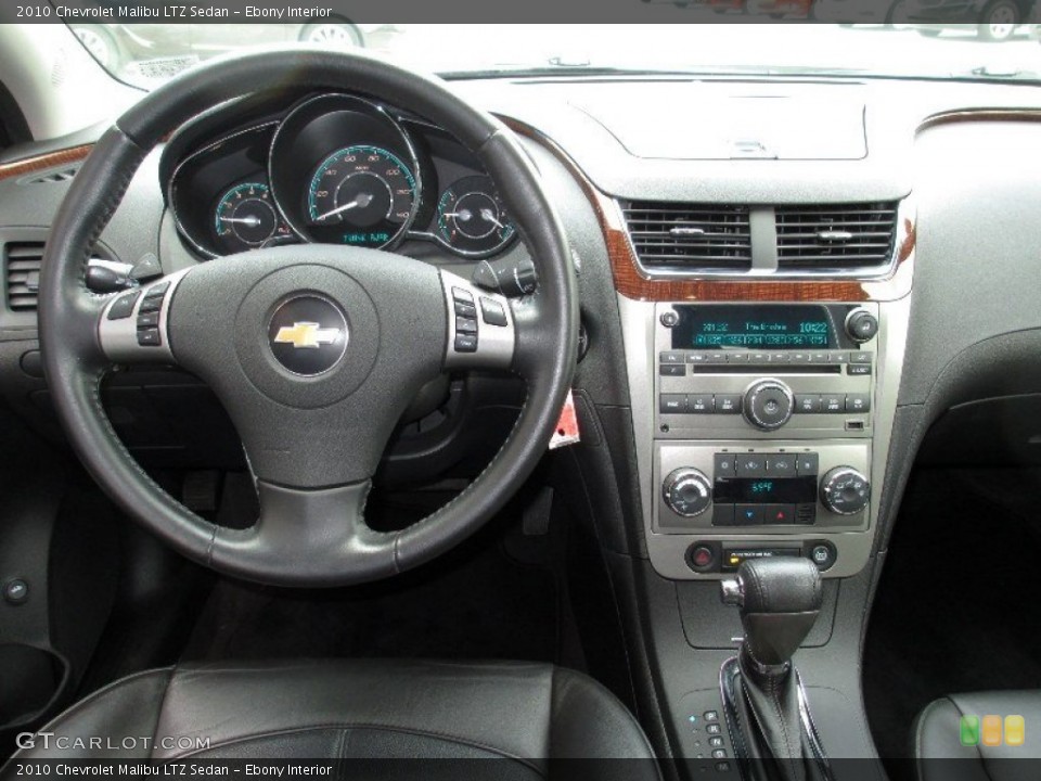 Ebony Interior Dashboard for the 2010 Chevrolet Malibu LTZ Sedan #82655875