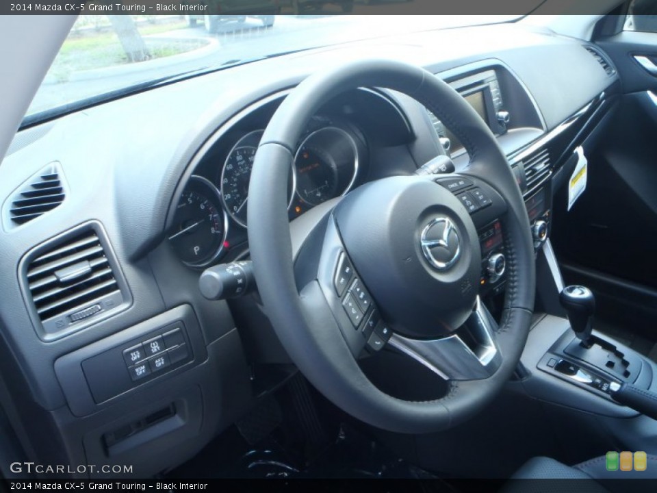Black Interior Steering Wheel for the 2014 Mazda CX-5 Grand Touring #82852561