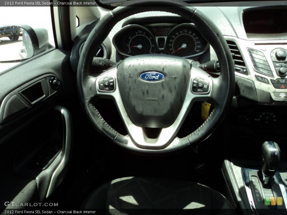 Charcoal Black Interior Steering Wheel for the 2012 Ford Fiesta SEL Sedan #82911688