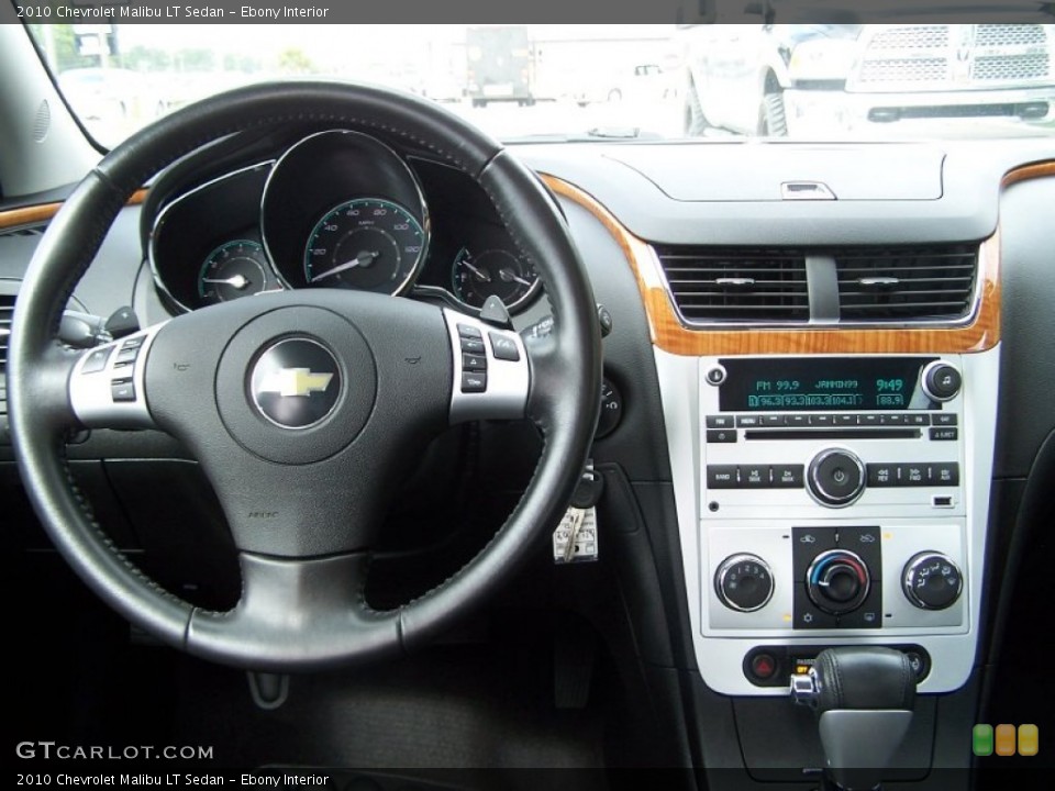 Ebony Interior Dashboard for the 2010 Chevrolet Malibu LT Sedan #83061228