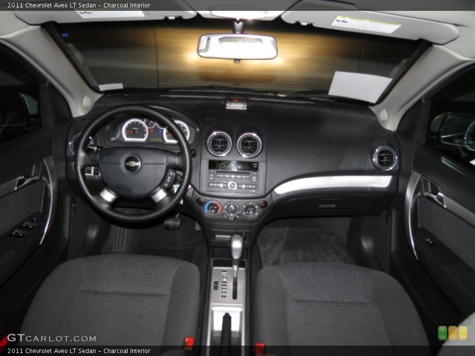 Charcoal Interior Dashboard for the 2011 Chevrolet Aveo LT Sedan #83125560