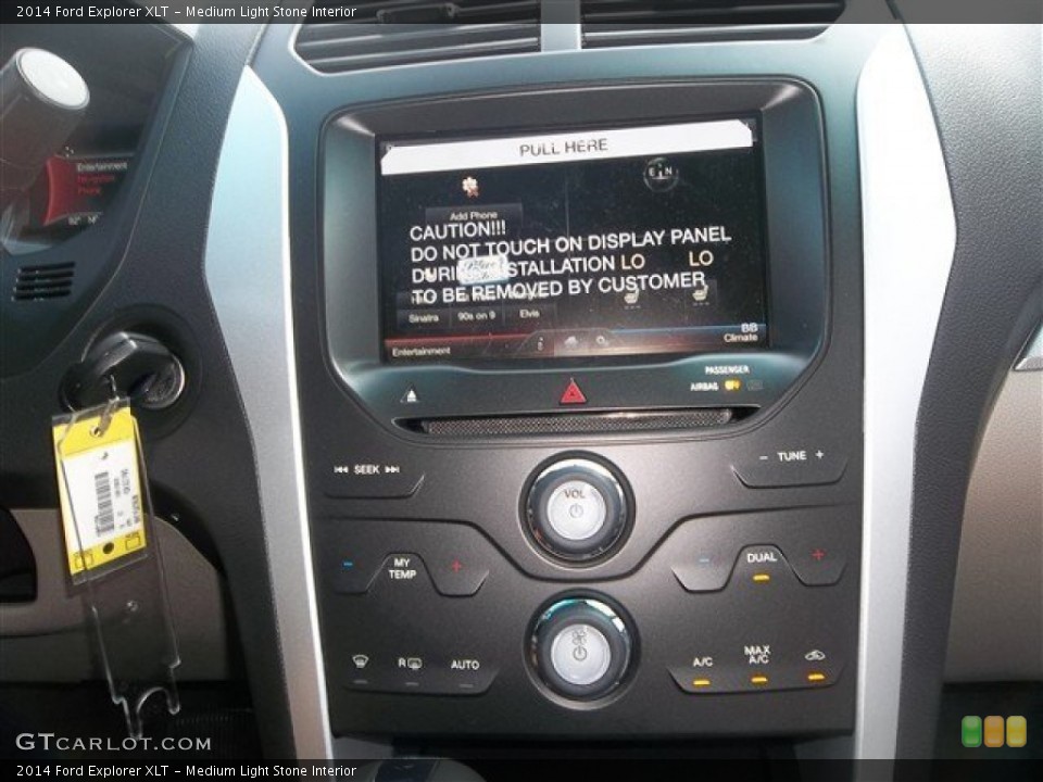 Medium Light Stone Interior Controls for the 2014 Ford Explorer XLT #83162652