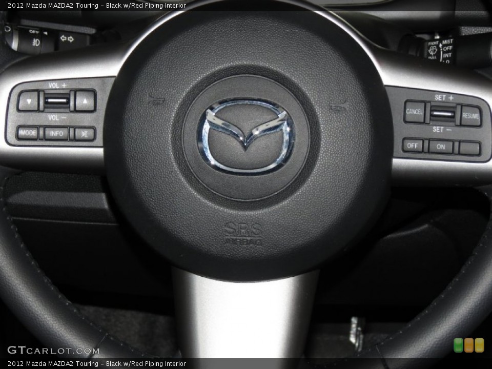 Black w/Red Piping Interior Controls for the 2012 Mazda MAZDA2 Touring #83273549