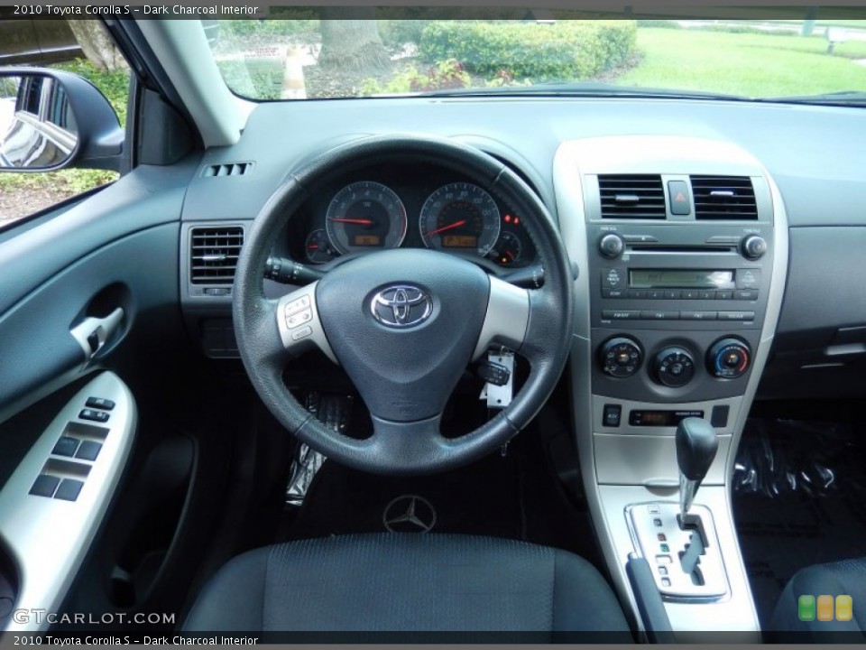 Dark Charcoal Interior Dashboard for the 2010 Toyota Corolla S #83382919