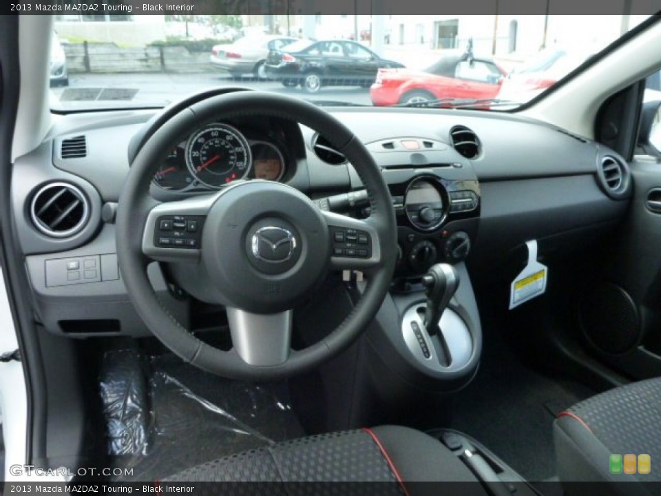 Black Interior Dashboard for the 2013 Mazda MAZDA2 Touring #83445910