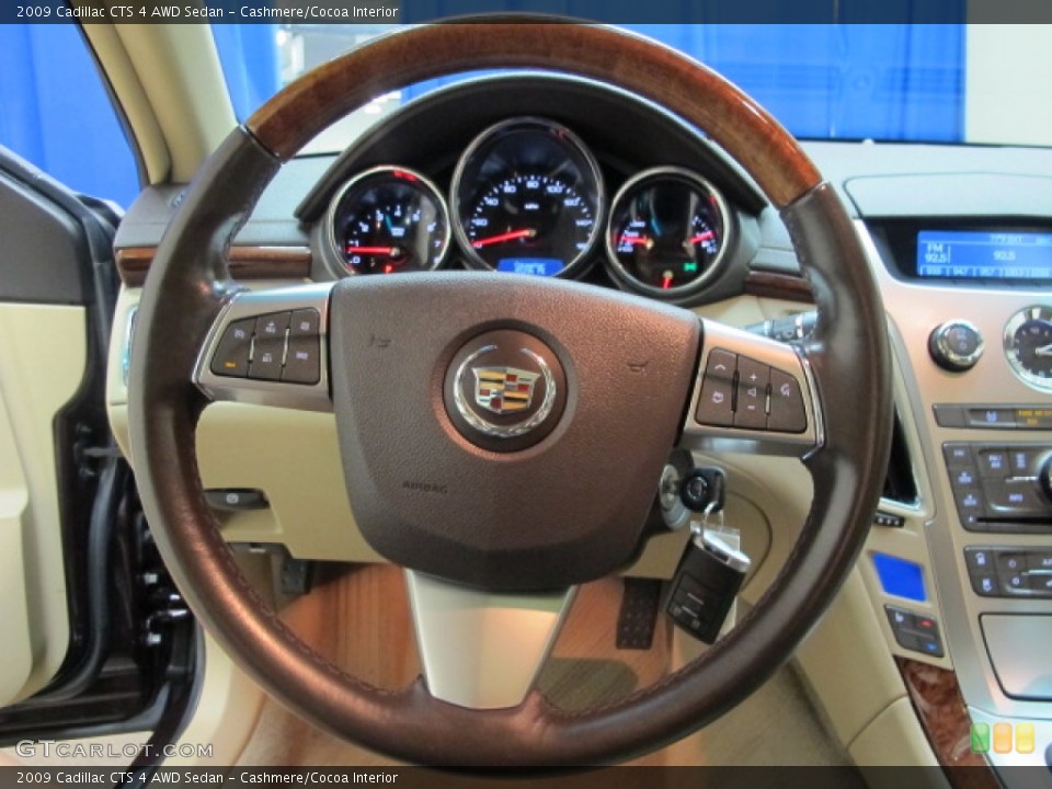 Cashmere/Cocoa Interior Steering Wheel for the 2009 Cadillac CTS 4 AWD Sedan #83453935