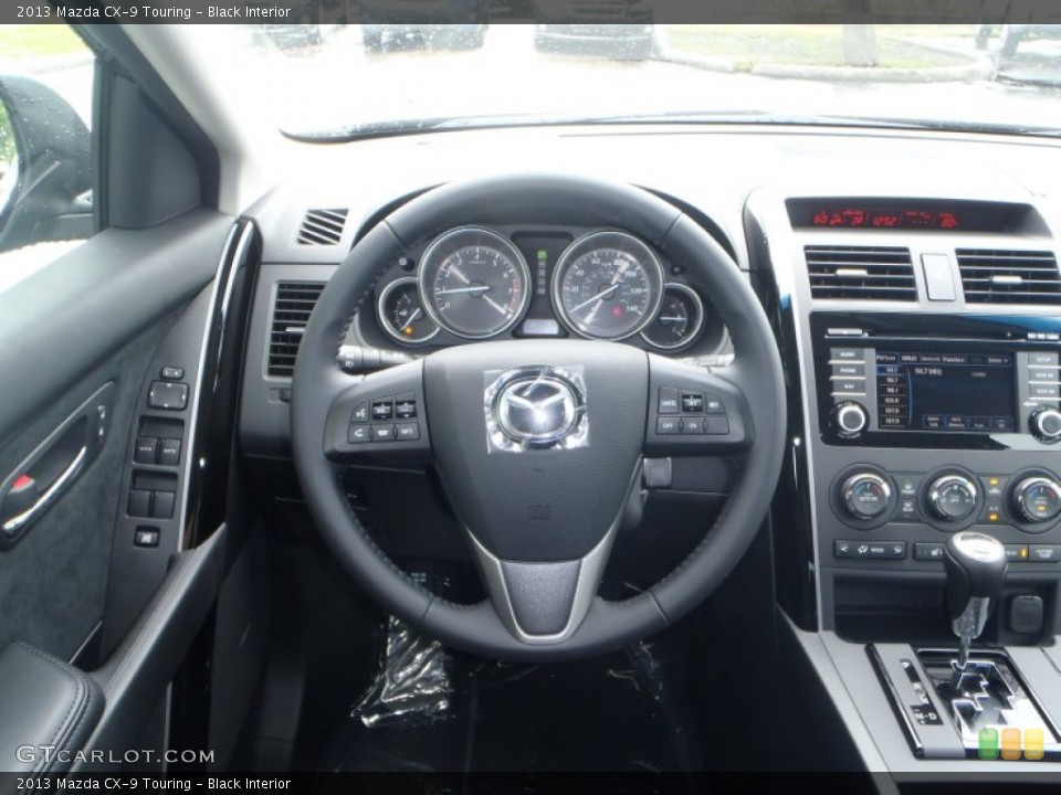 Black Interior Steering Wheel for the 2013 Mazda CX-9 Touring #83506362