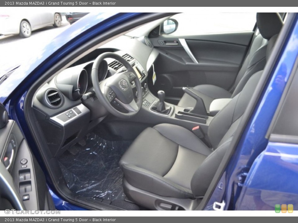 Black Interior Front Seat for the 2013 Mazda MAZDA3 i Grand Touring 5 Door #83554458
