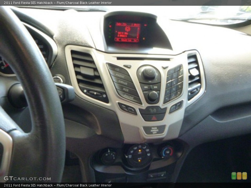 Plum/Charcoal Black Leather Interior Controls for the 2011 Ford Fiesta SES Hatchback #83649829