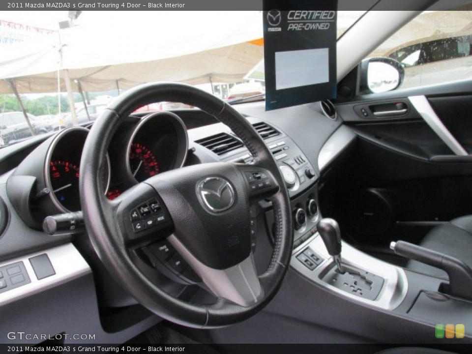 Black Interior Dashboard for the 2011 Mazda MAZDA3 s Grand Touring 4 Door #83699308