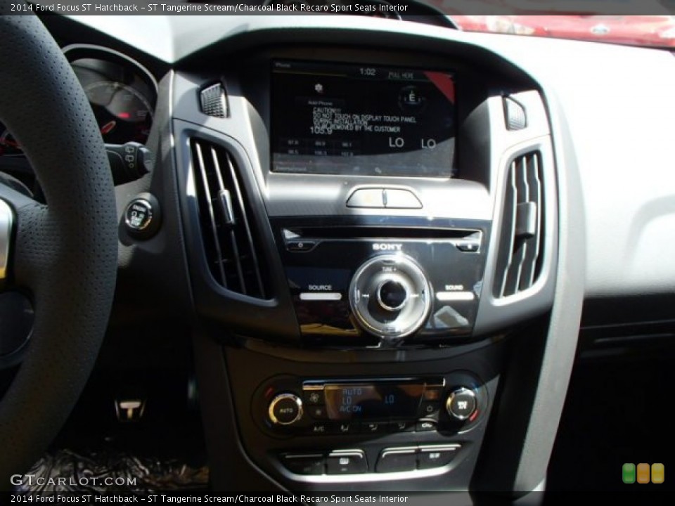 ST Tangerine Scream/Charcoal Black Recaro Sport Seats Interior Controls for the 2014 Ford Focus ST Hatchback #83961639