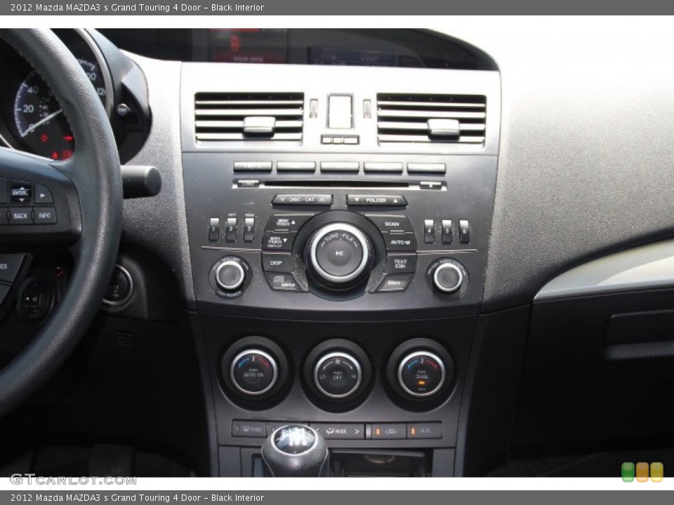 Black Interior Controls for the 2012 Mazda MAZDA3 s Grand Touring 4 Door #84149130