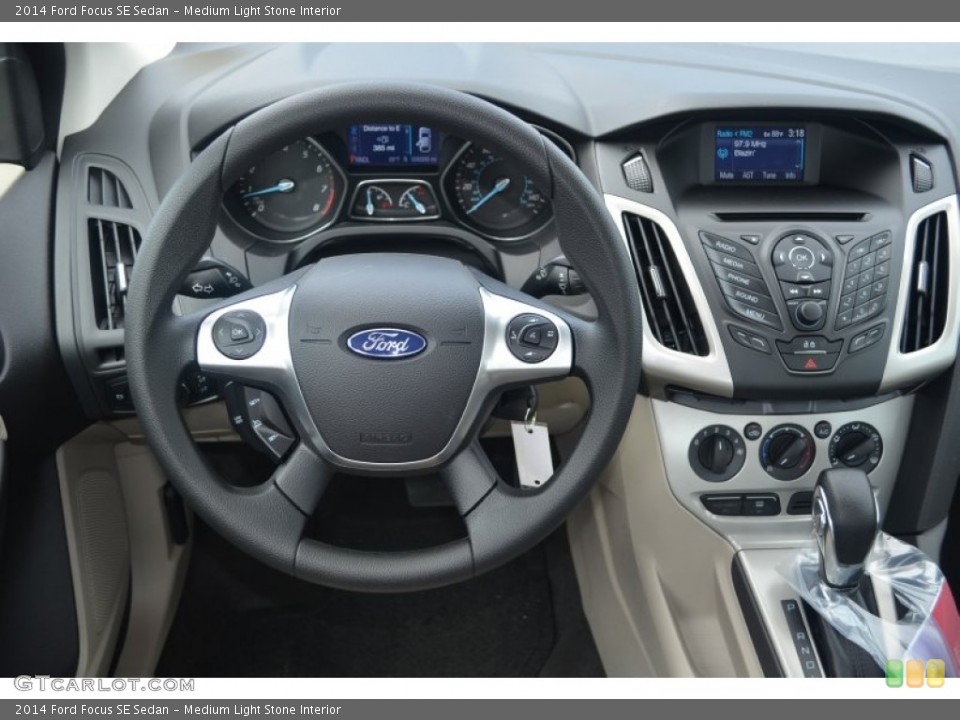 Medium Light Stone Interior Steering Wheel for the 2014 Ford Focus SE Sedan #84155625