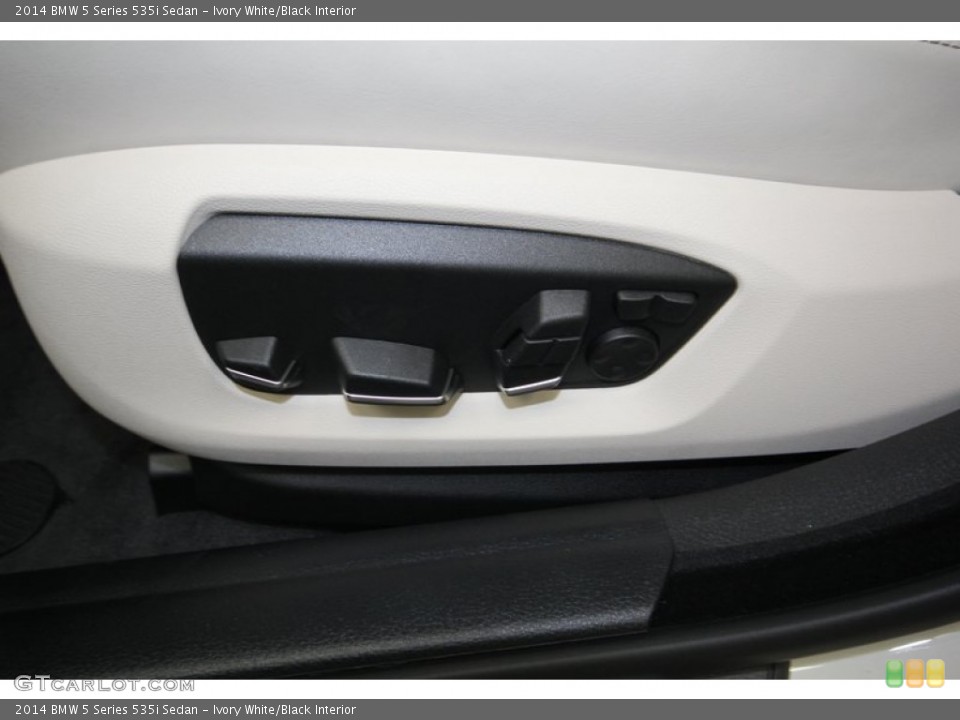 Ivory White/Black Interior Controls for the 2014 BMW 5 Series 535i Sedan #84224225