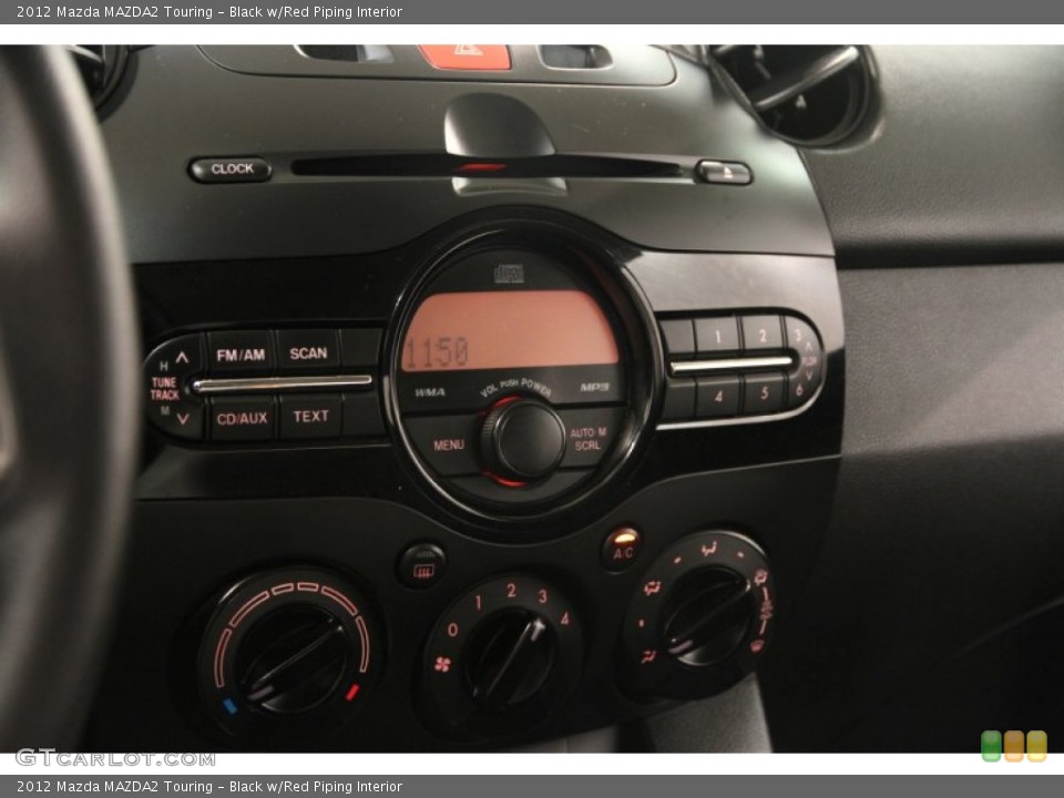 Black w/Red Piping Interior Controls for the 2012 Mazda MAZDA2 Touring #84229291
