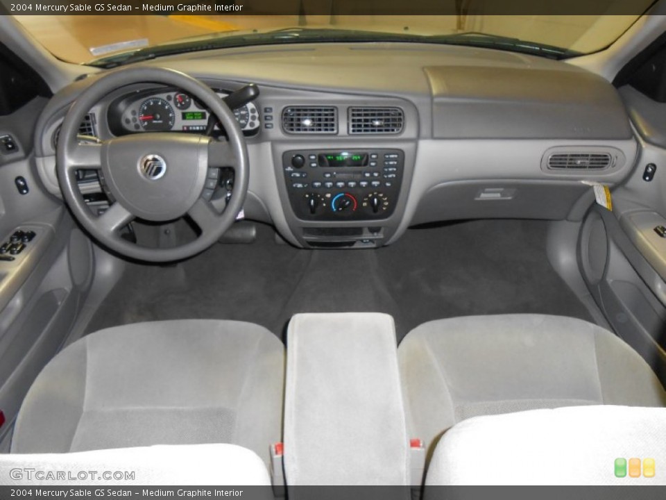 Medium Graphite Interior Dashboard for the 2004 Mercury Sable GS Sedan #84319797