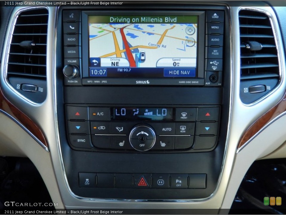 Black/Light Frost Beige Interior Controls for the 2011 Jeep Grand Cherokee Limited #84608011