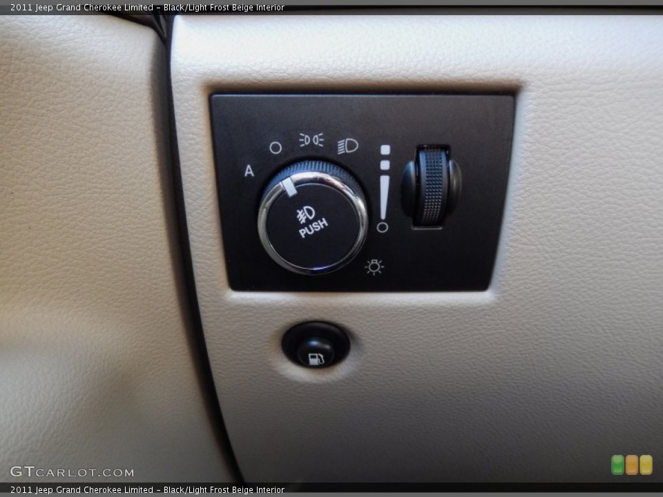 Black/Light Frost Beige Interior Controls for the 2011 Jeep Grand Cherokee Limited #84608062