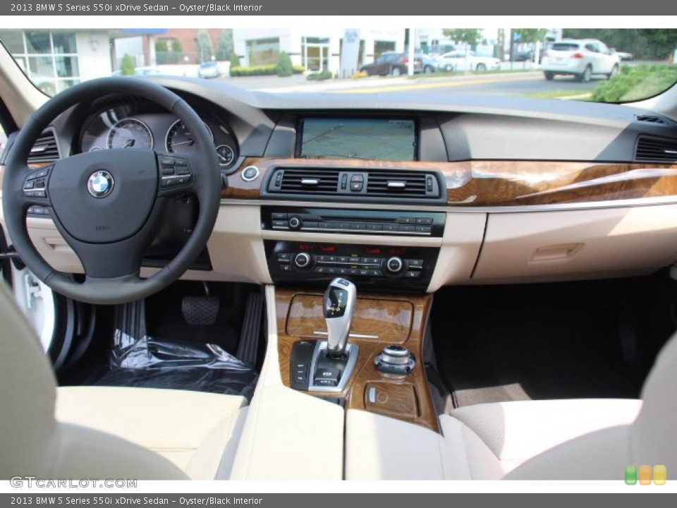Oyster/Black Interior Dashboard for the 2013 BMW 5 Series 550i xDrive Sedan #84850305