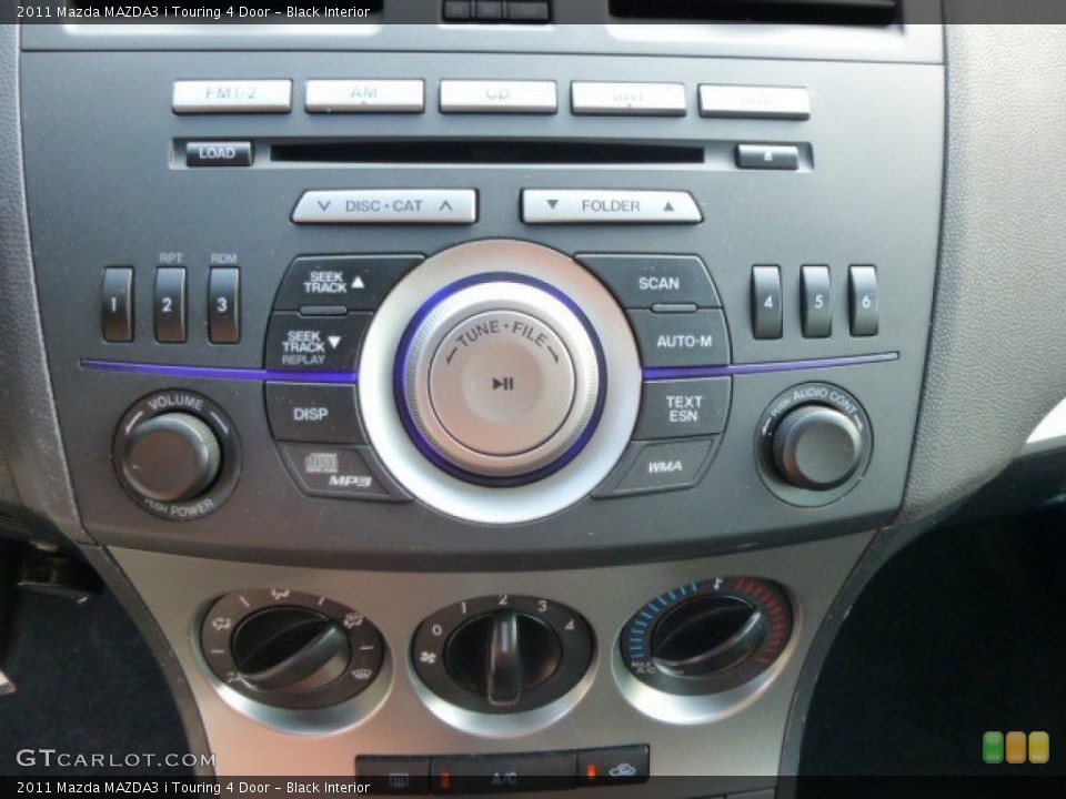 Black Interior Controls for the 2011 Mazda MAZDA3 i Touring 4 Door #84979121