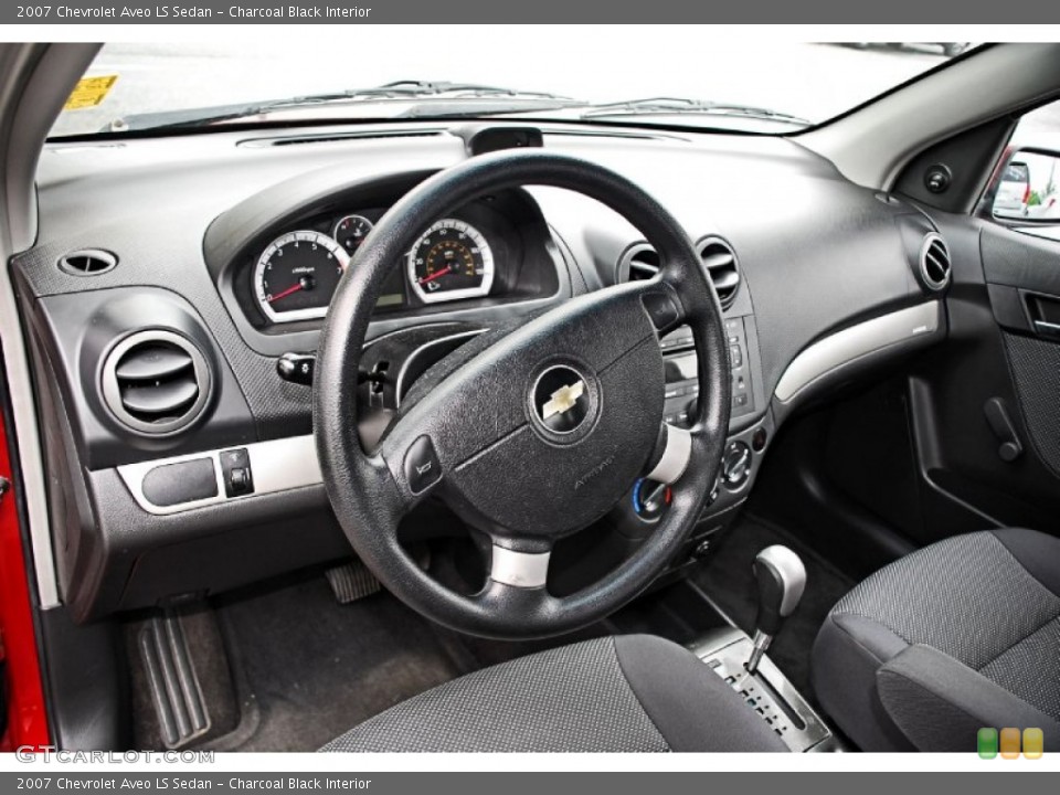 Charcoal Black Interior Dashboard for the 2007 Chevrolet Aveo LS Sedan #84987104