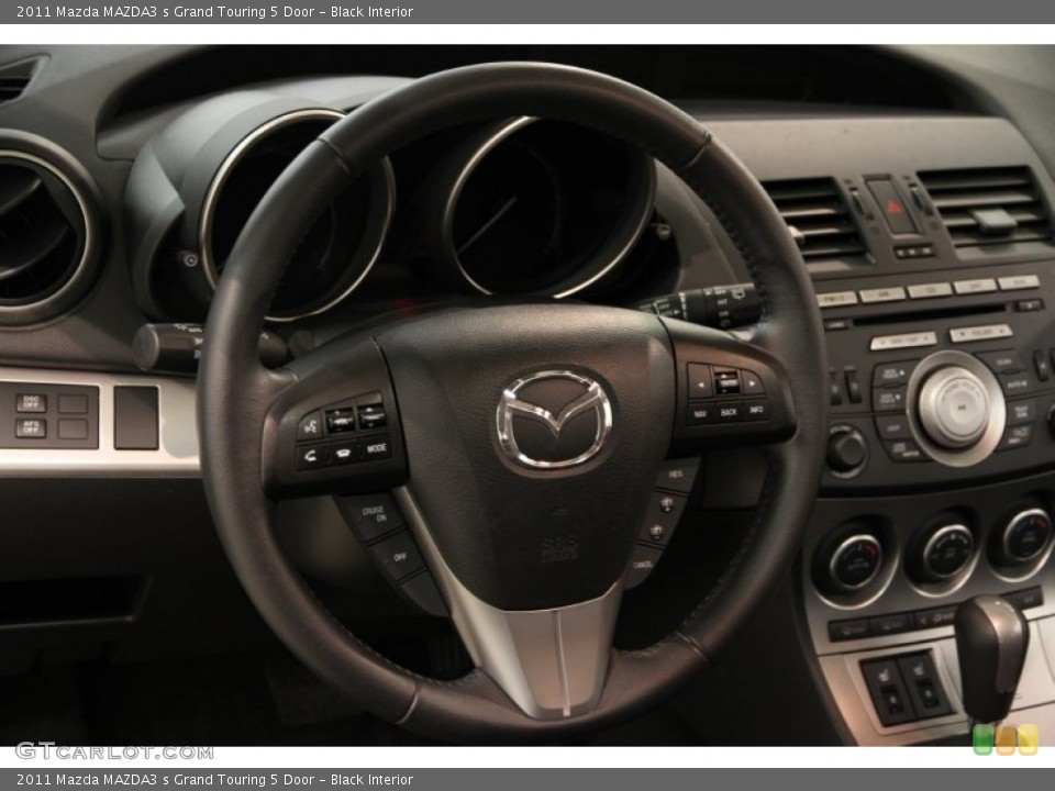 Black Interior Steering Wheel for the 2011 Mazda MAZDA3 s Grand Touring 5 Door #85275392