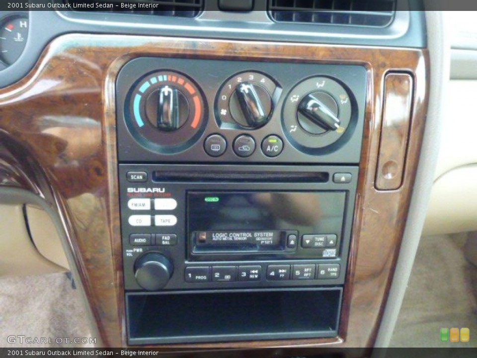 Beige Interior Controls for the 2001 Subaru Outback Limited Sedan #85276643