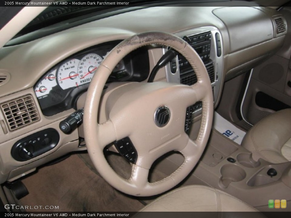 Medium Dark Parchment Interior Steering Wheel for the 2005 Mercury Mountaineer V6 AWD #85647856