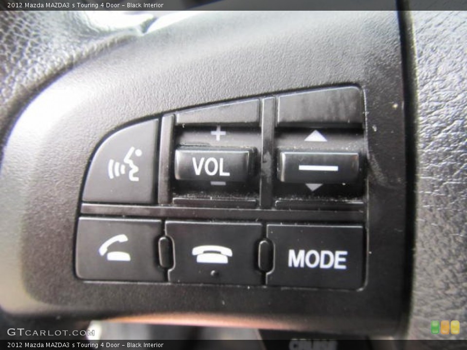 Black Interior Controls for the 2012 Mazda MAZDA3 s Touring 4 Door #85718782