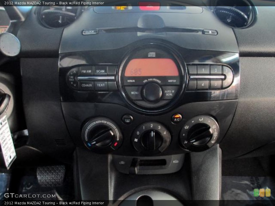 Black w/Red Piping Interior Controls for the 2012 Mazda MAZDA2 Touring #85862911