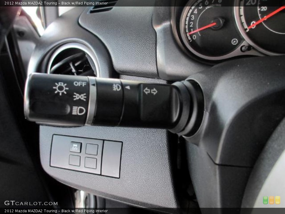 Black w/Red Piping Interior Controls for the 2012 Mazda MAZDA2 Touring #85862986
