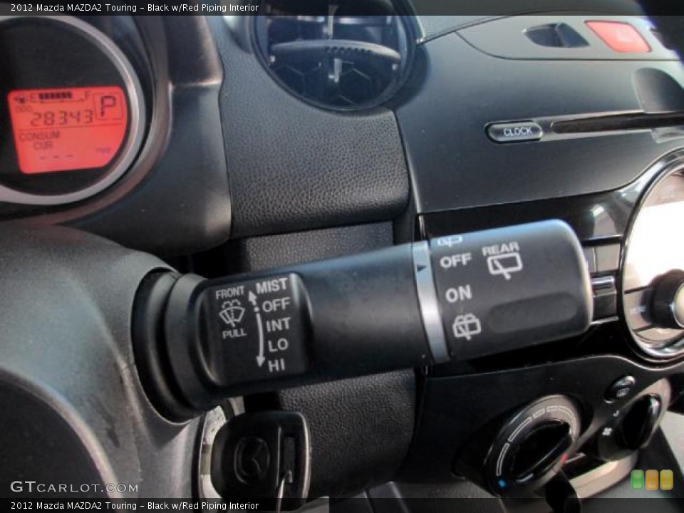Black w/Red Piping Interior Controls for the 2012 Mazda MAZDA2 Touring #85863046