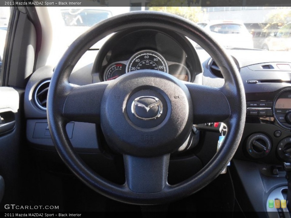 Black Interior Steering Wheel for the 2011 Mazda MAZDA2 Sport #85873321