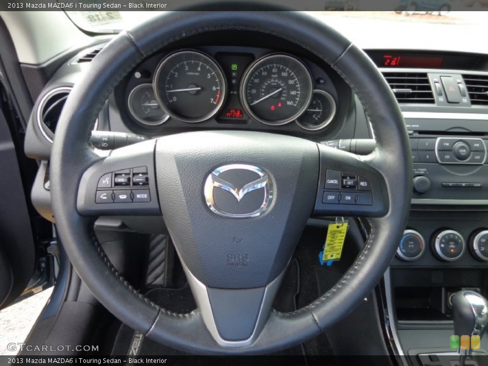 Black Interior Steering Wheel for the 2013 Mazda MAZDA6 i Touring Sedan #86648896