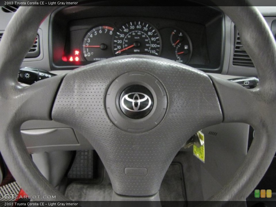 Light Gray Interior Steering Wheel for the 2003 Toyota Corolla CE #86935930