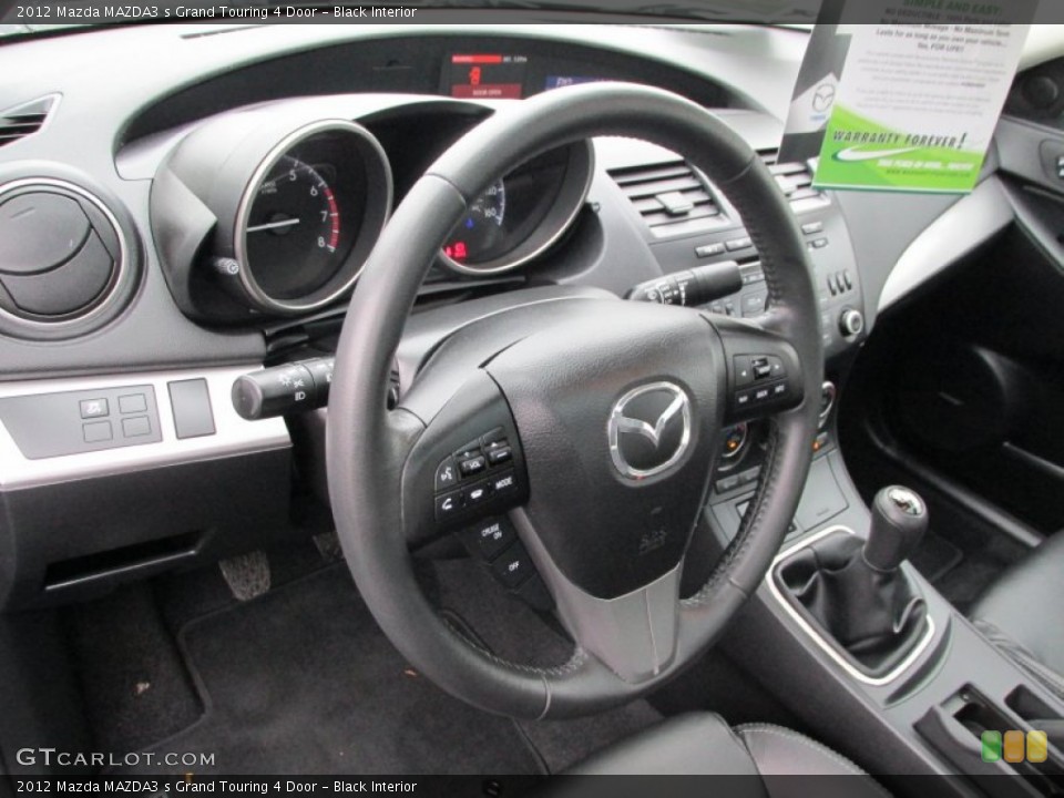 Black Interior Steering Wheel for the 2012 Mazda MAZDA3 s Grand Touring 4 Door #87438728