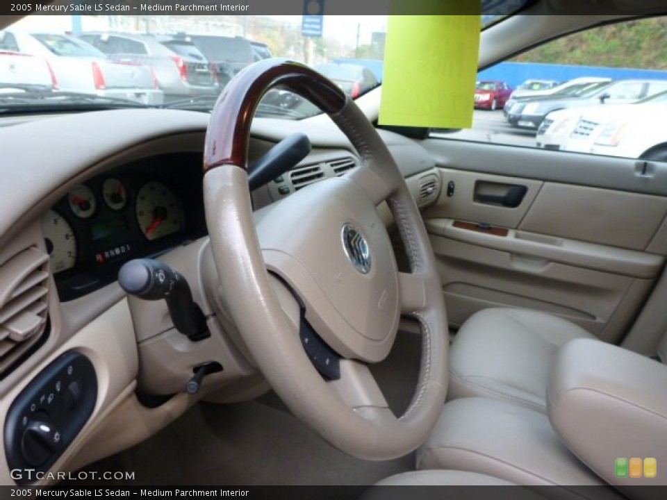 Medium Parchment Interior Steering Wheel for the 2005 Mercury Sable LS Sedan #87848024