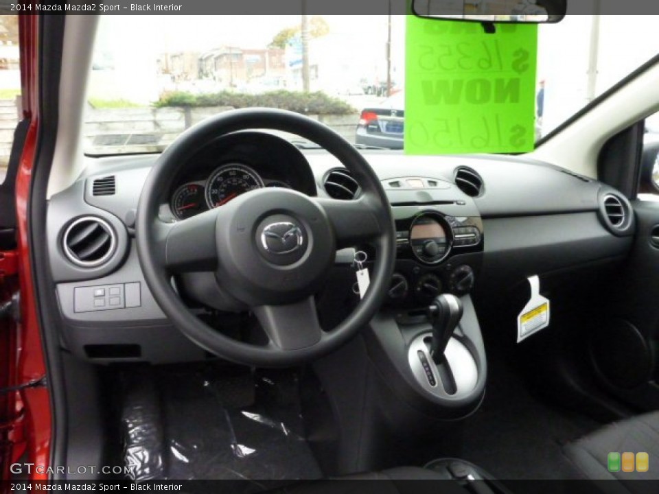 Black Interior Dashboard for the 2014 Mazda Mazda2 Sport #87853475