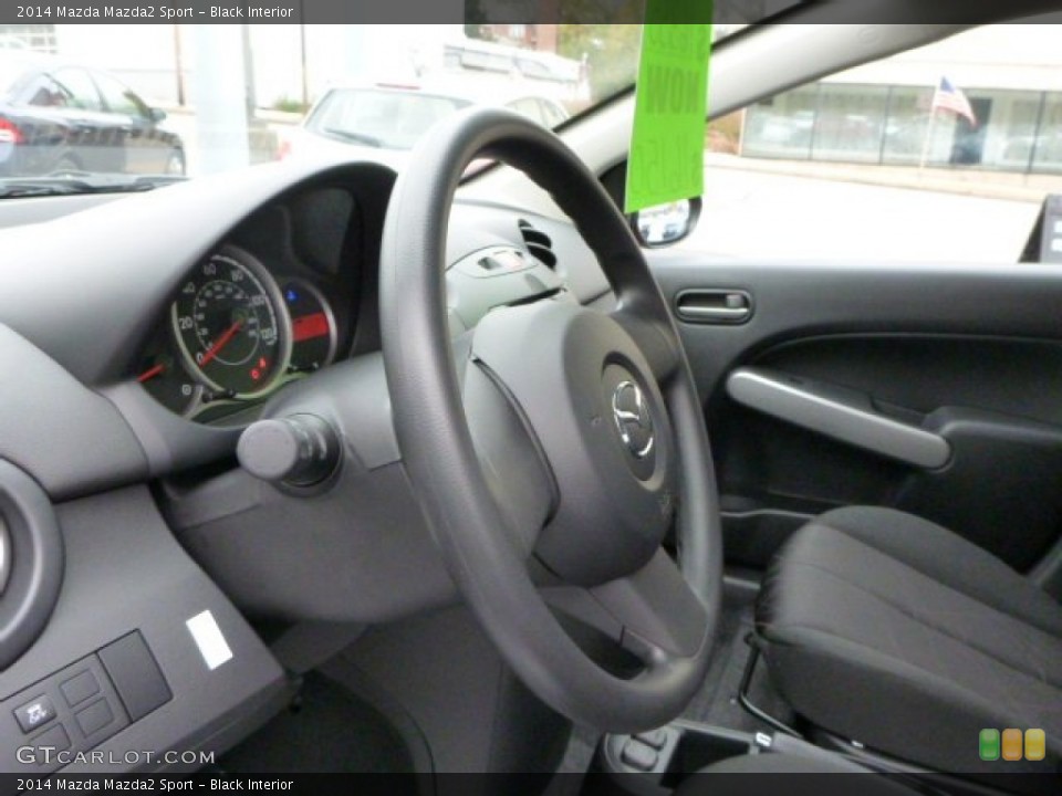 Black Interior Steering Wheel for the 2014 Mazda Mazda2 Sport #87853547
