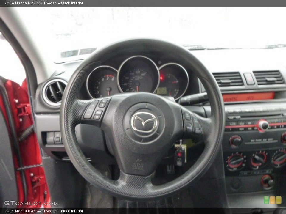 Black Interior Steering Wheel for the 2004 Mazda MAZDA3 i Sedan #88287129