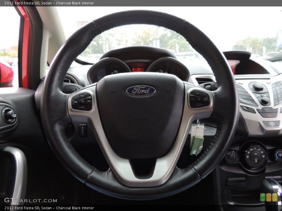 Charcoal Black Interior Steering Wheel for the 2012 Ford Fiesta SEL Sedan #89027421