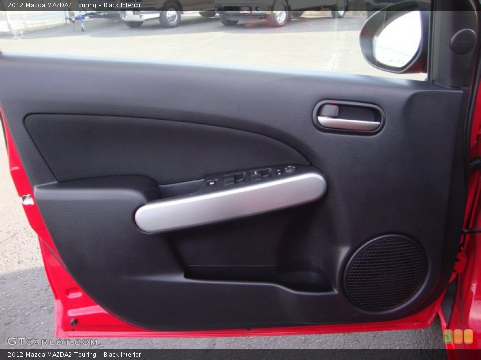 Black Interior Door Panel for the 2012 Mazda MAZDA2 Touring #89277825