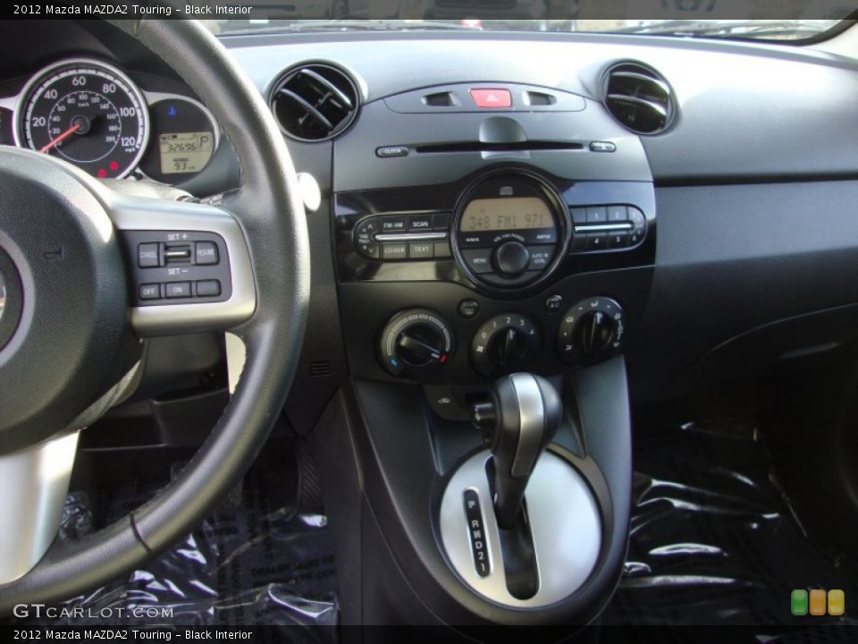 Black Interior Controls for the 2012 Mazda MAZDA2 Touring #89277942
