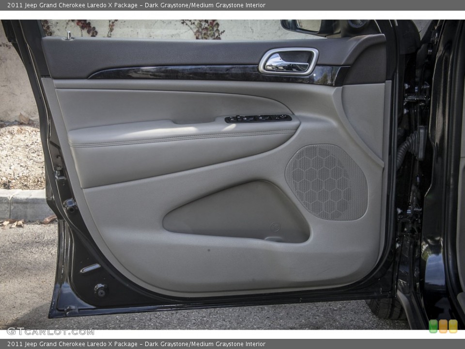 Dark Graystone/Medium Graystone Interior Door Panel for the 2011 Jeep Grand Cherokee Laredo X Package #89522152