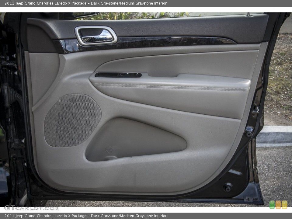 Dark Graystone/Medium Graystone Interior Door Panel for the 2011 Jeep Grand Cherokee Laredo X Package #89522350