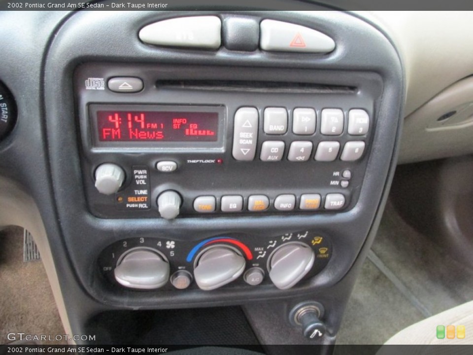 Dark Taupe Interior Controls for the 2002 Pontiac Grand Am SE Sedan #89872648