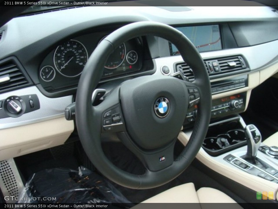 Oyster/Black Interior Dashboard for the 2011 BMW 5 Series 550i xDrive Sedan #89909746
