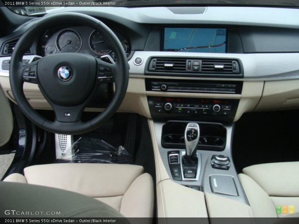 Oyster/Black Interior Dashboard for the 2011 BMW 5 Series 550i xDrive Sedan #89909800